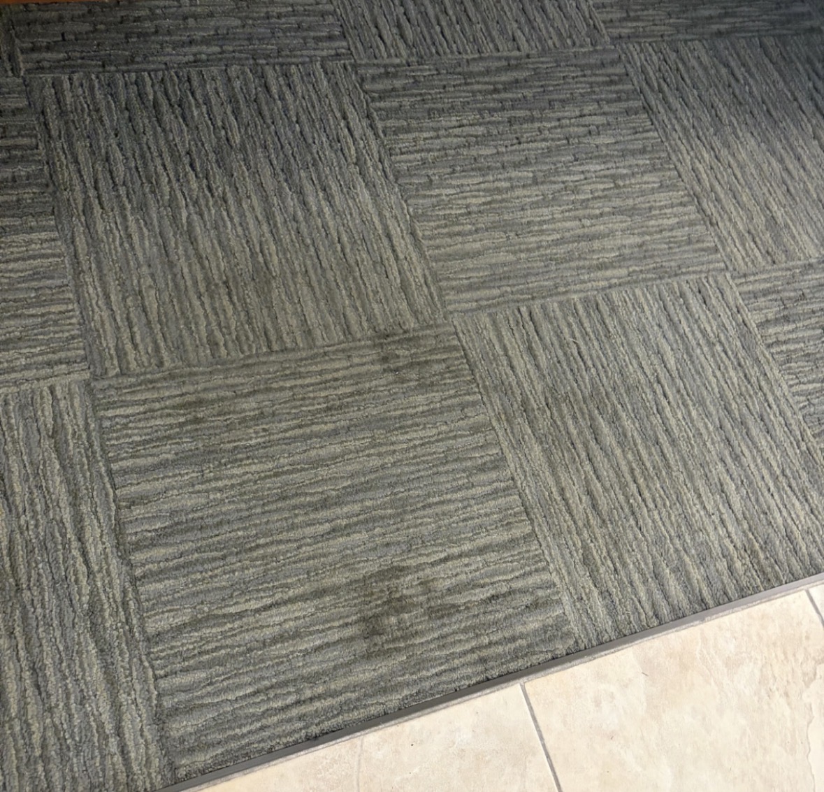 Before: a tired carpet in need of cleaning